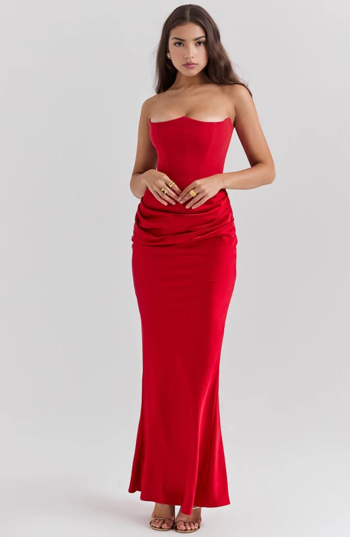 Strapless lace evening dress with flowing skirt, structured bodice.