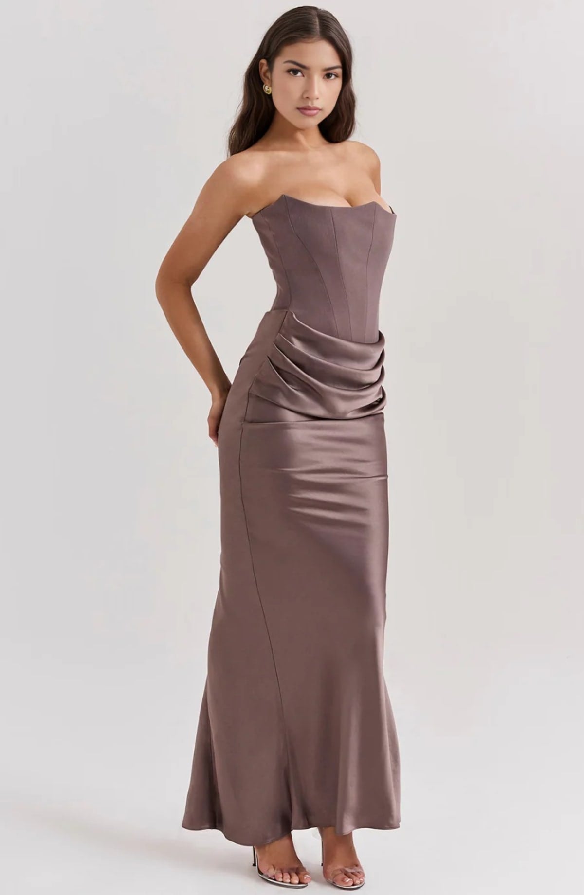Strapless lace evening dress with flowing skirt, structured bodice.