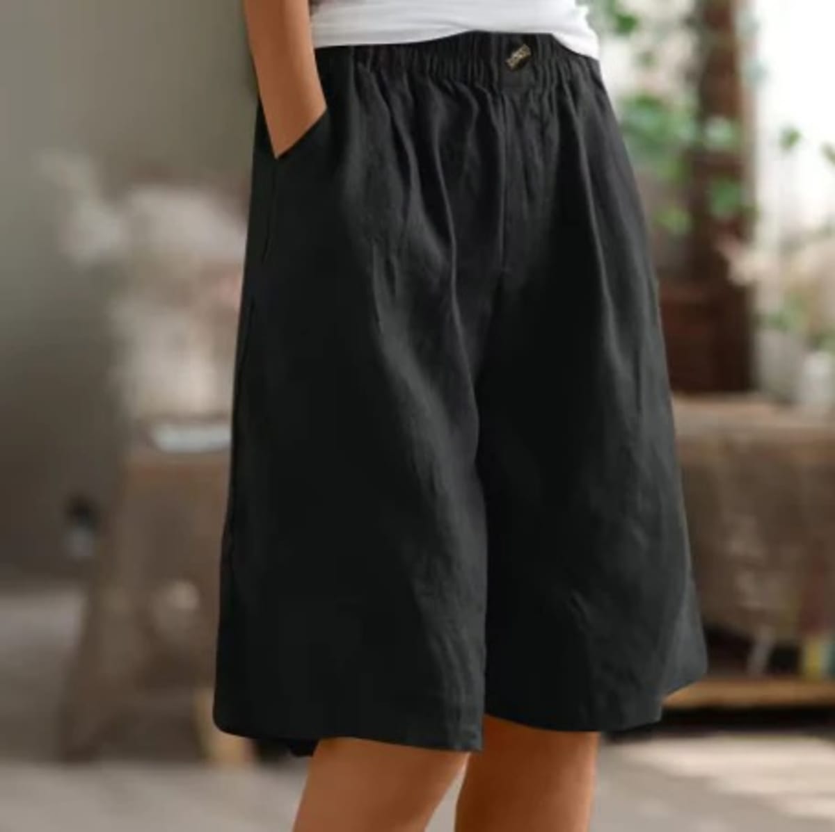 Elastic waistband shorts, relaxed fit, mid-thigh length.