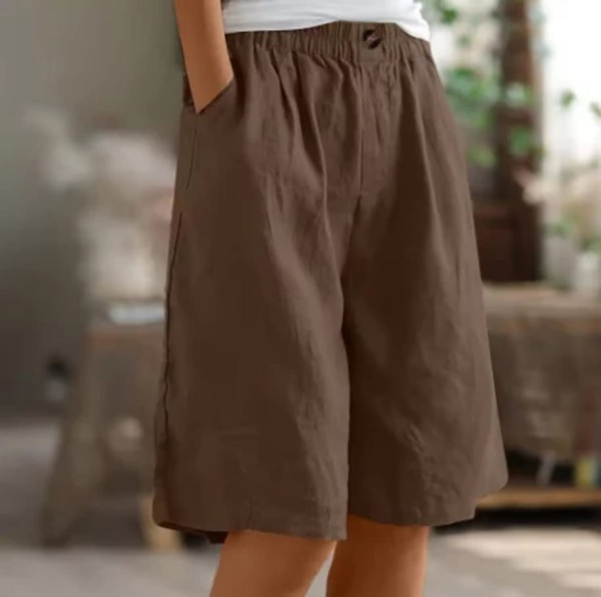 Elastic waistband shorts, relaxed fit, mid-thigh length.