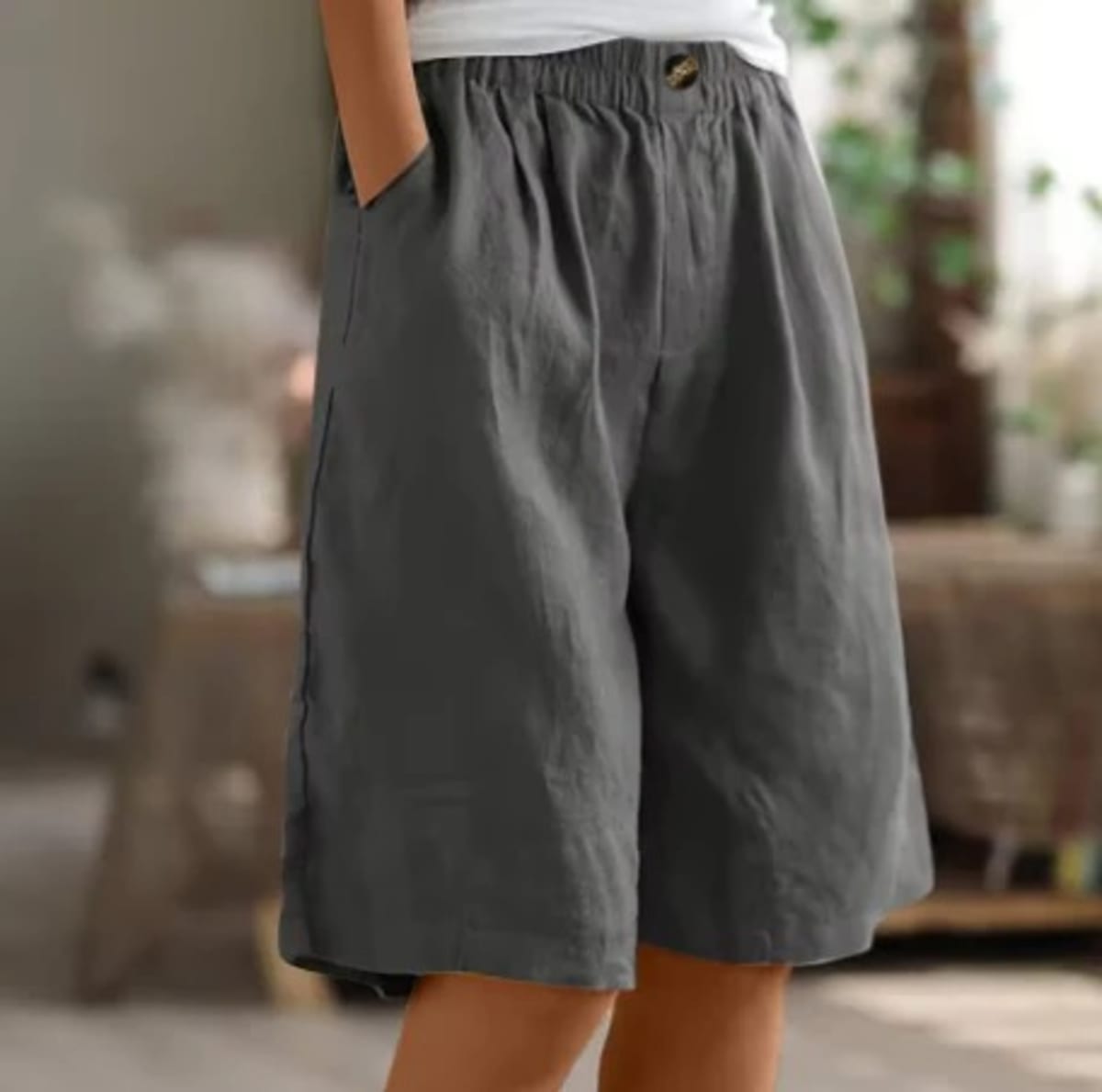 Elastic waistband shorts, relaxed fit, mid-thigh length.