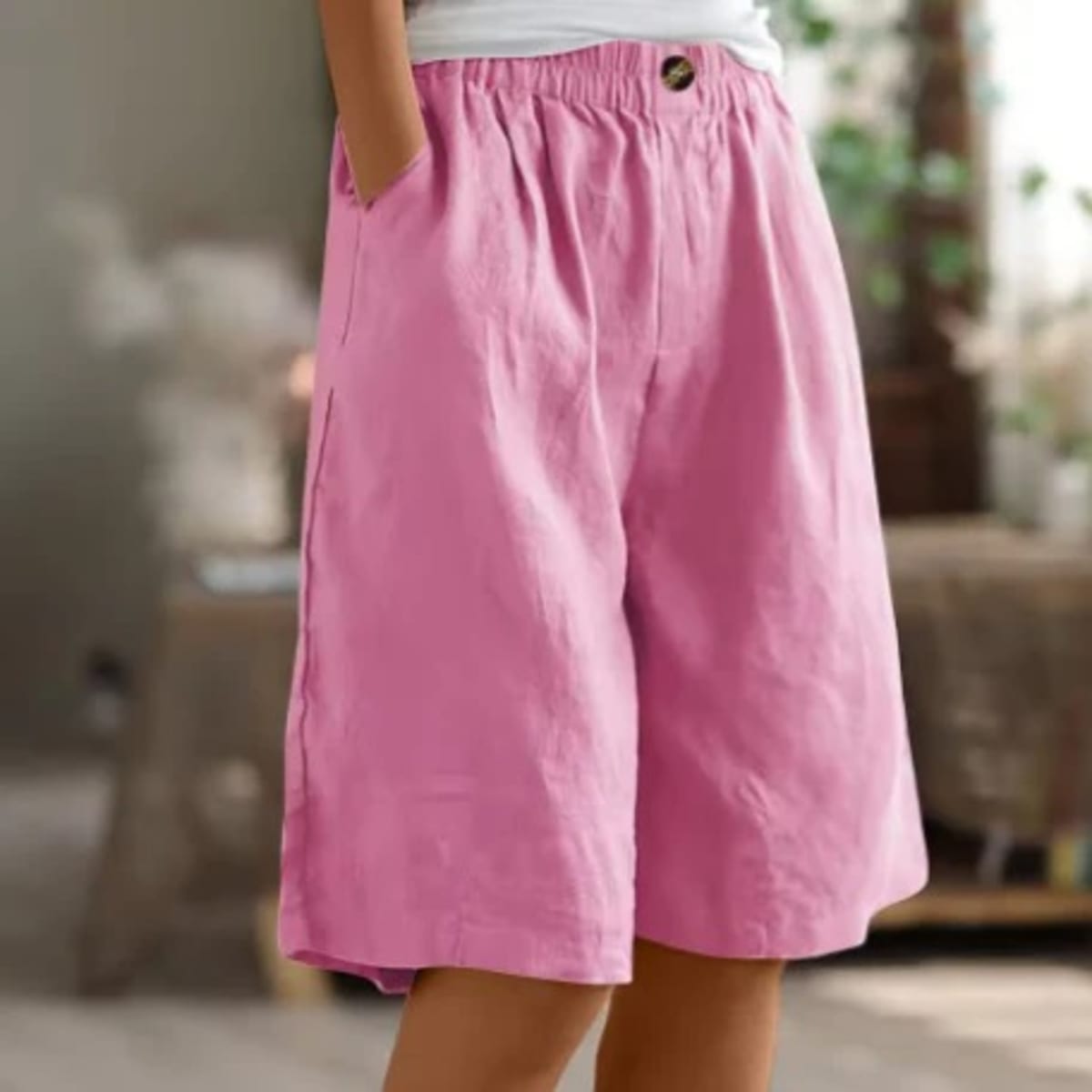 Elastic waistband shorts, relaxed fit, mid-thigh length.