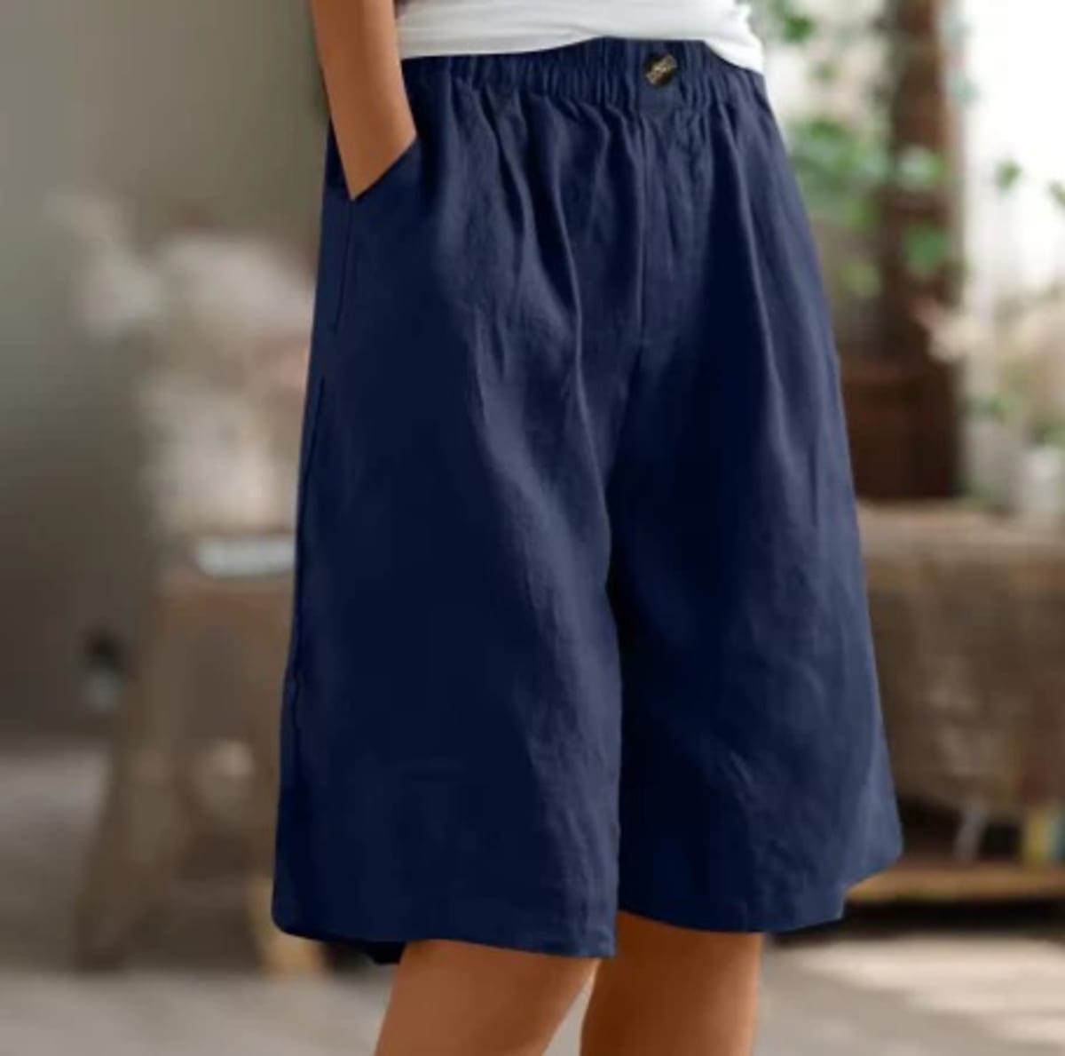Elastic waistband shorts, relaxed fit, mid-thigh length.
