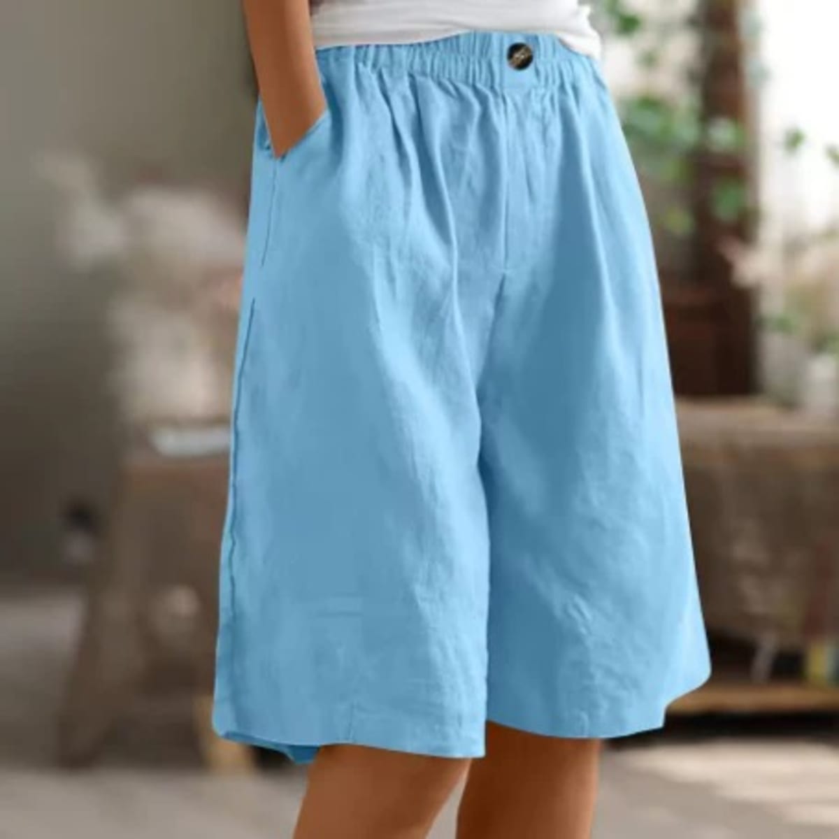 Elastic waistband shorts, relaxed fit, mid-thigh length.