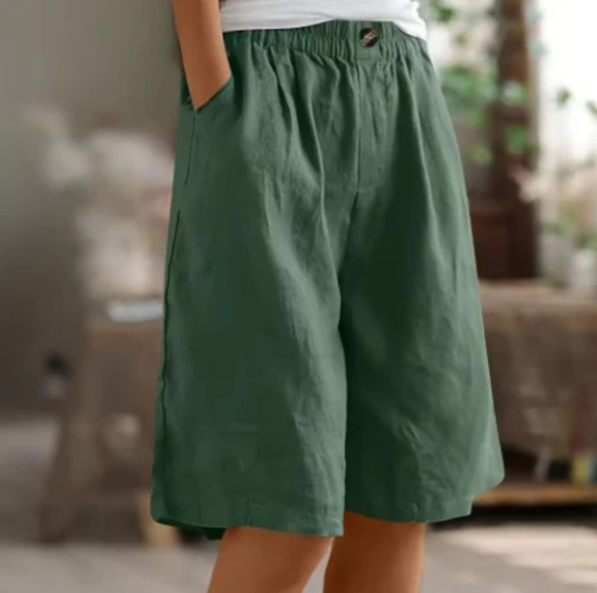 Elastic waistband shorts, relaxed fit, mid-thigh length.