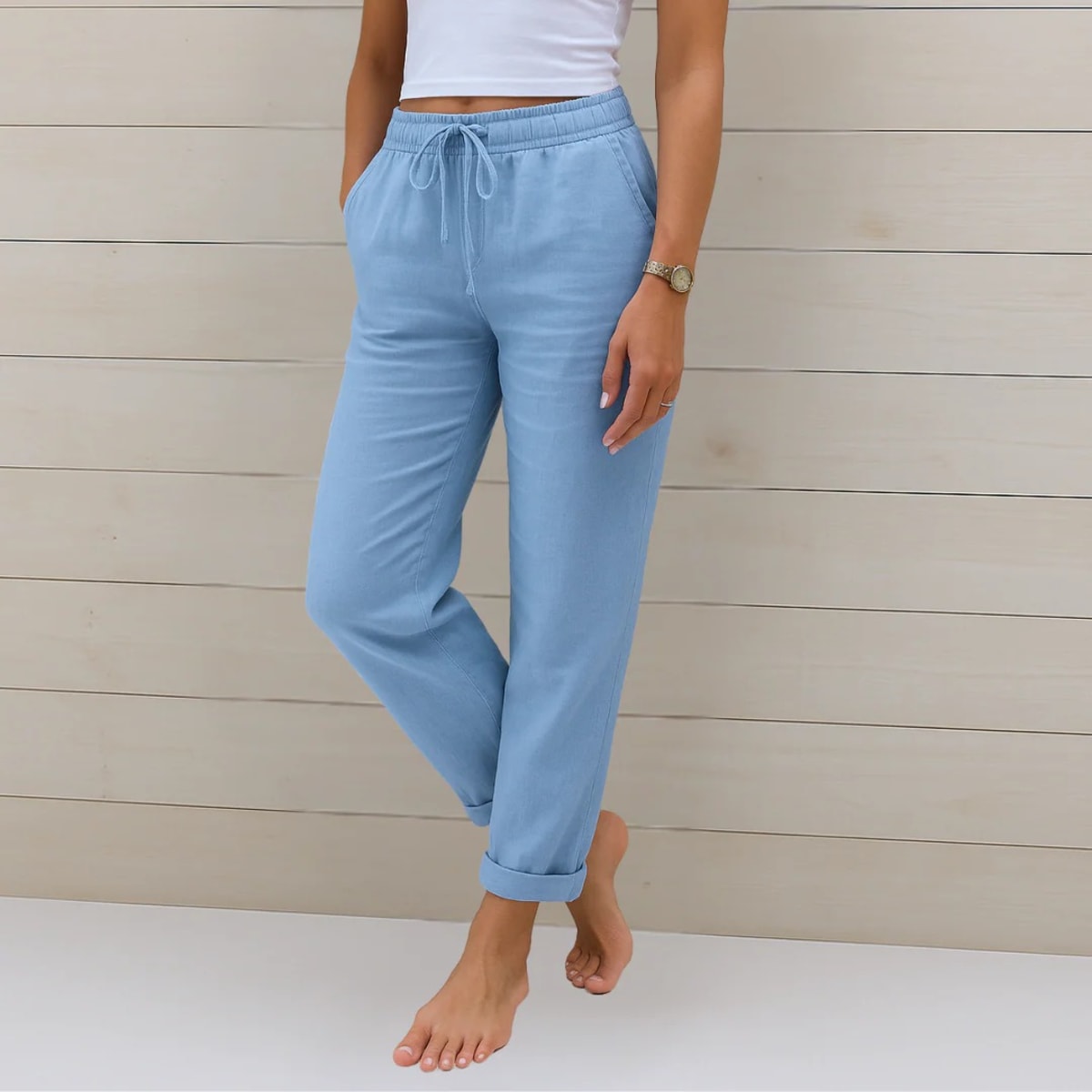 Elastic waist pants with relaxed fit, suitable for casual wear.