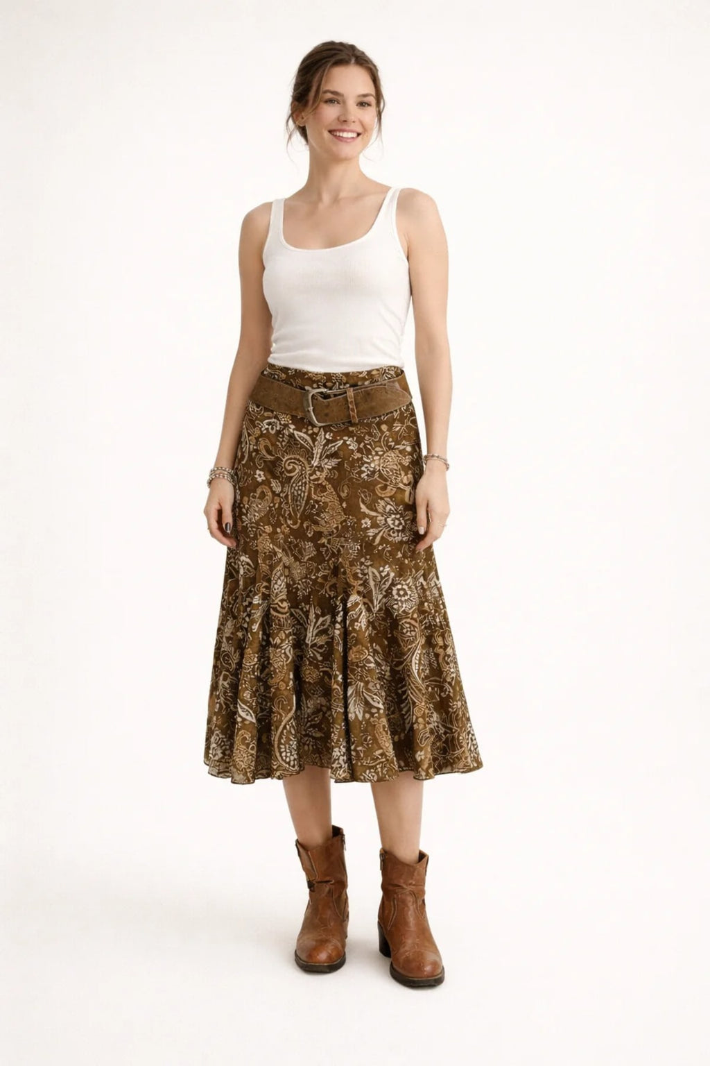 Woman wearing paisley midi skirt with flared hem and high waist.