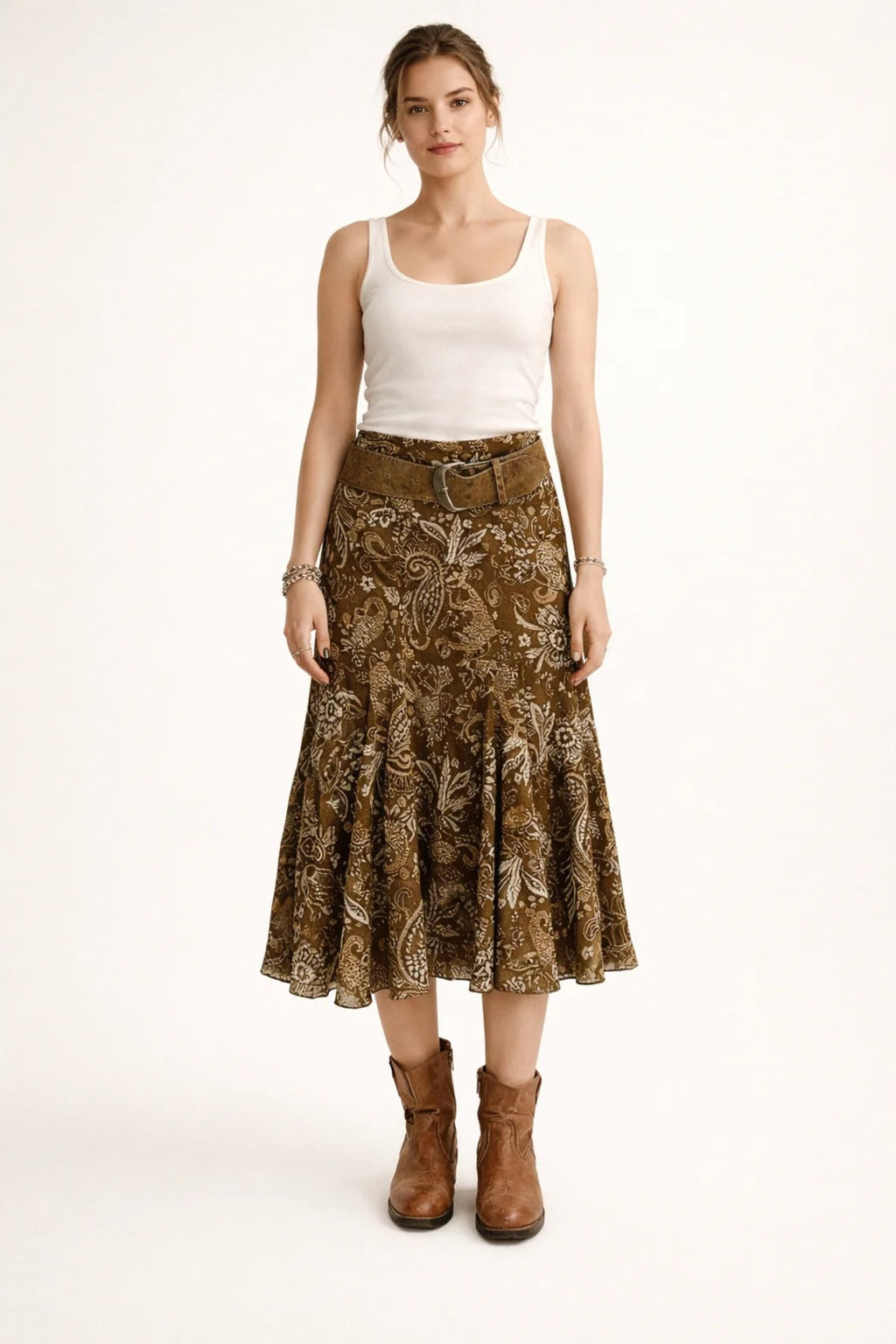 Woman wearing paisley midi skirt with flared hem and high waist.
