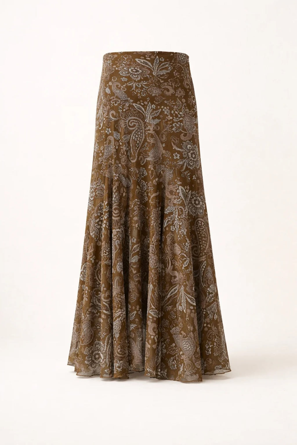 Woman wearing paisley midi skirt with flared hem and high waist.