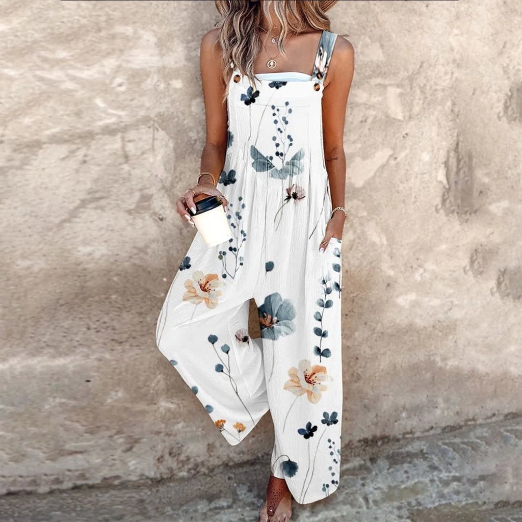 Sleeveless wide-leg jumpsuit with floral print and adjustable straps.