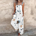 Sleeveless wide-leg jumpsuit with floral print and adjustable straps.