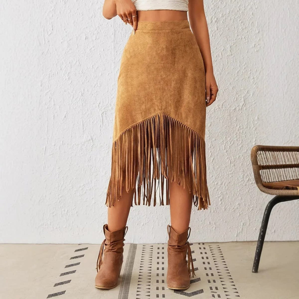 Woman wearing a midi skirt with fringe trim and asymmetrical hem.