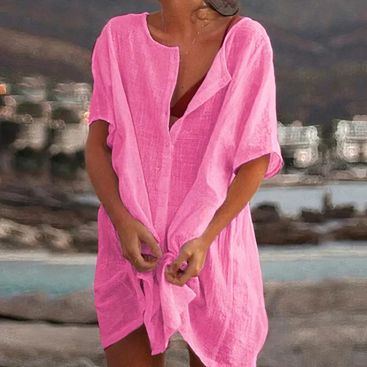 Relaxed fit shirt dress with button-up front and short sleeves.
