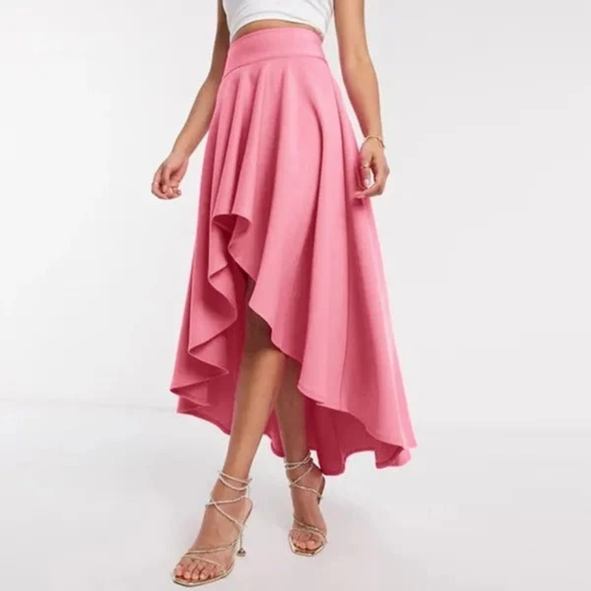 Model wearing high-waisted flared high-low midi skirt.