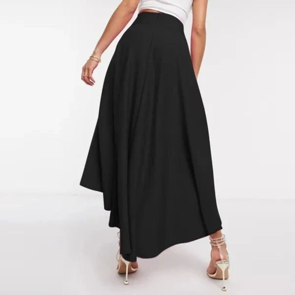 Model wearing high-waisted flared high-low midi skirt.