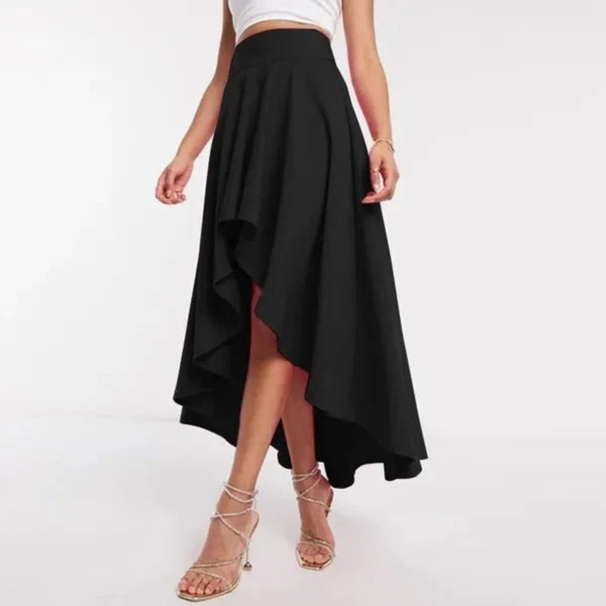 Model wearing high-waisted flared high-low midi skirt.