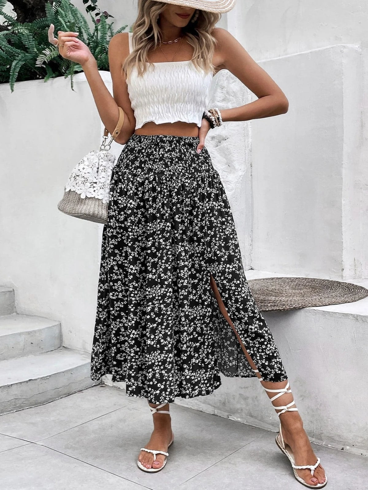 Woman wearing a navy floral midi skirt with smocked waist