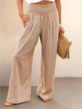 Women's high-waist wide-leg pants with smocked waistband.