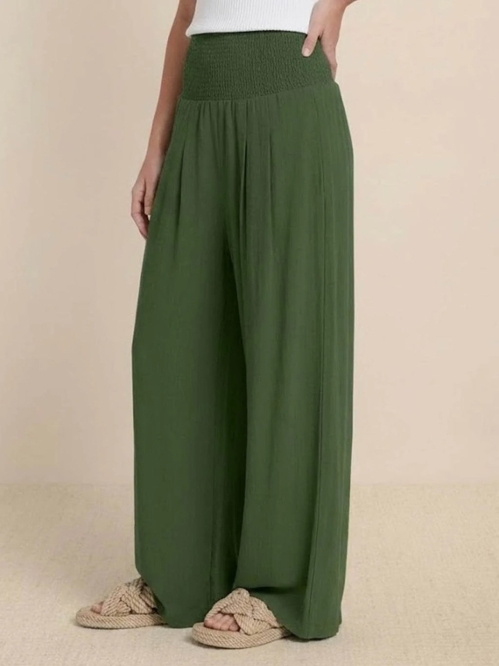 Women's high-waist wide-leg pants with smocked waistband.