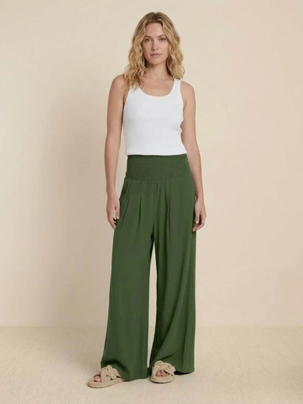 Women's high-waist wide-leg pants with smocked waistband.