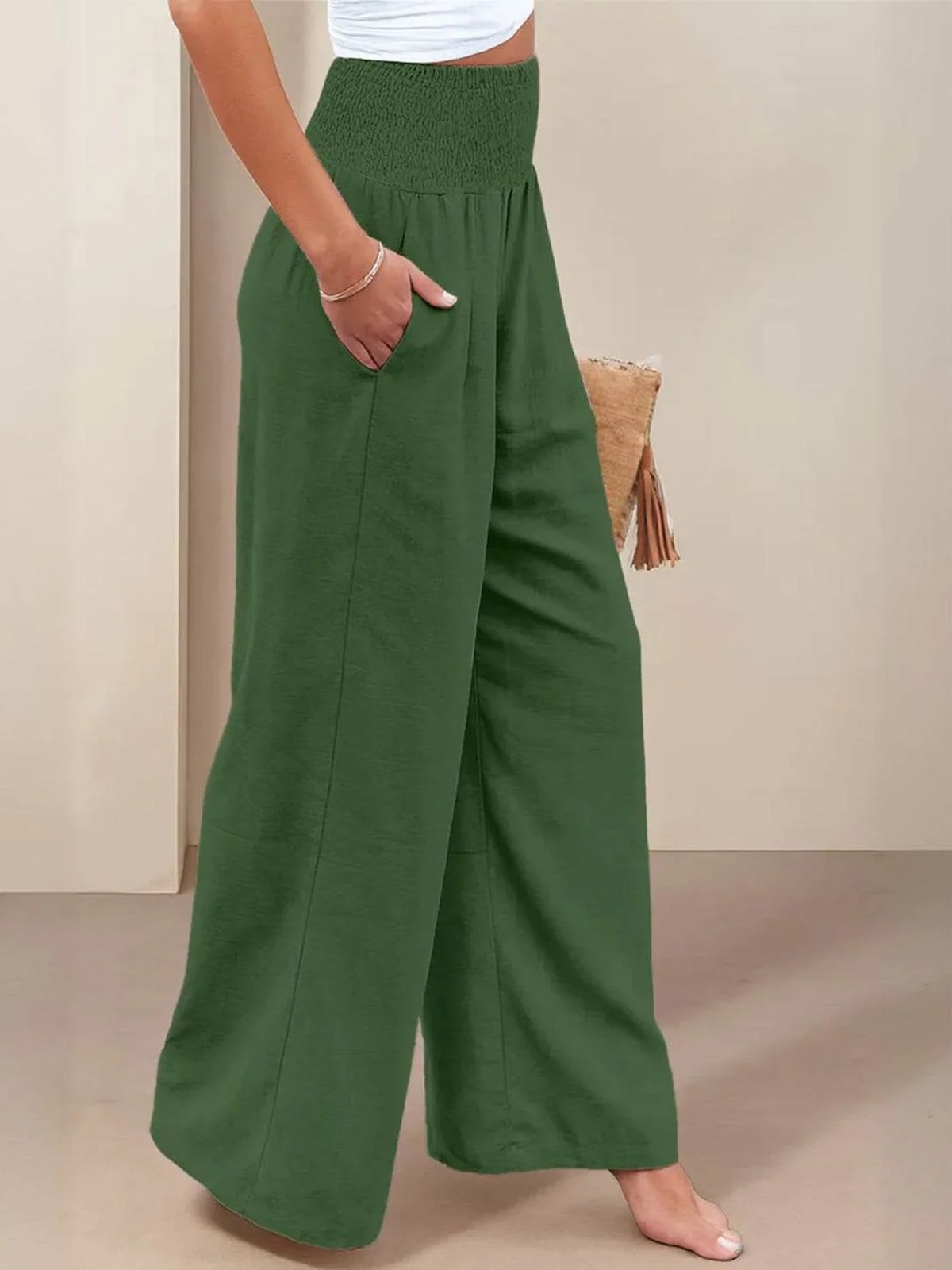 Women's high-waist wide-leg pants with smocked waistband.
