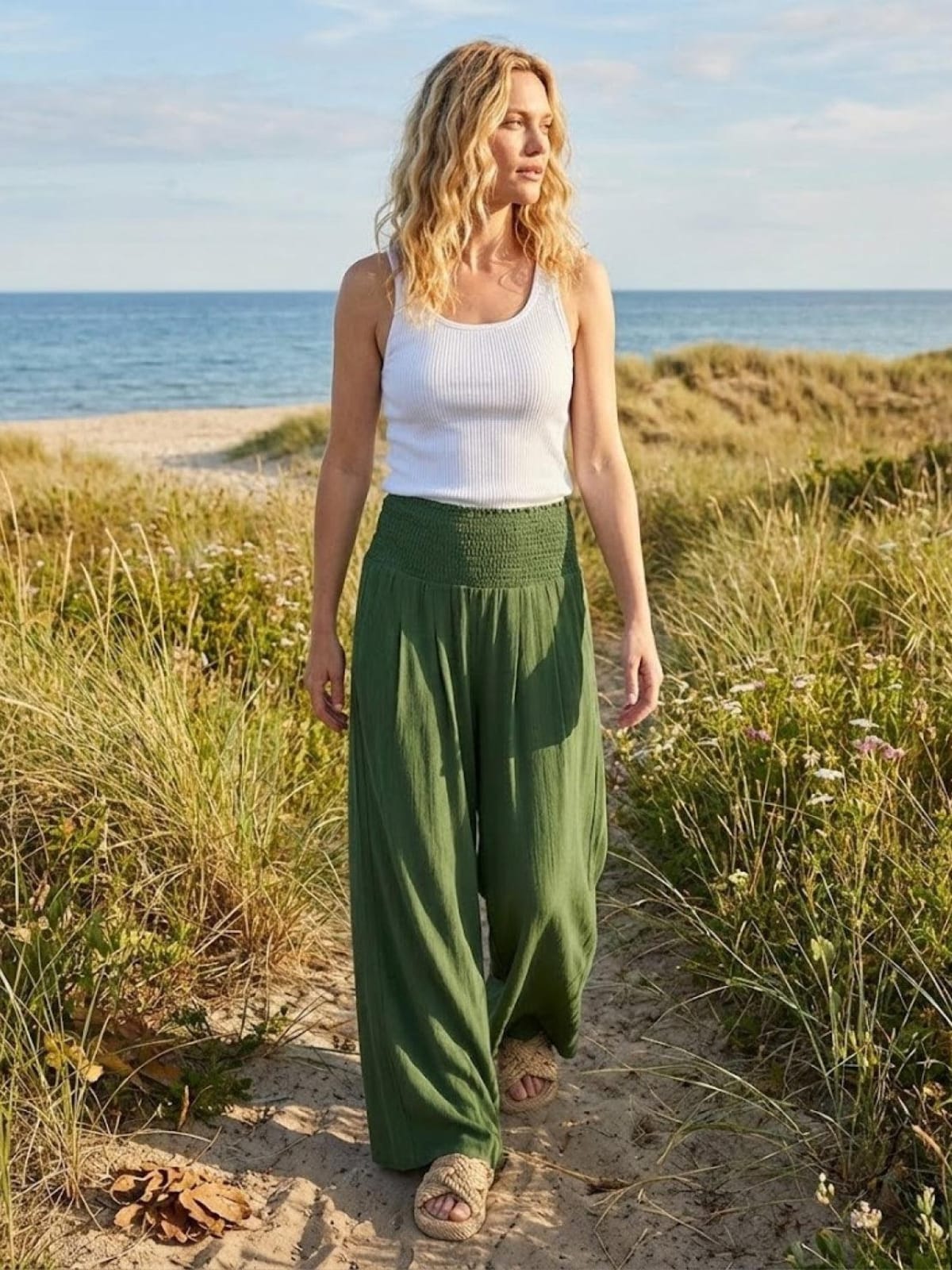 Women's high-waist wide-leg pants with smocked waistband.
