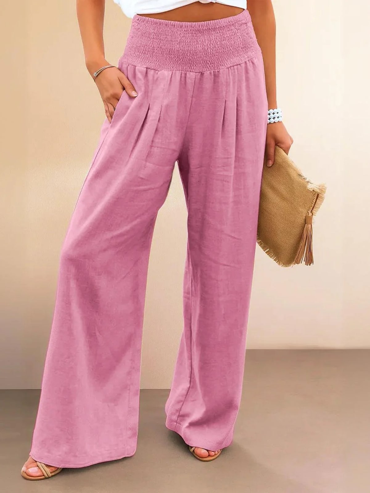 Women's high-waist wide-leg pants with smocked waistband.