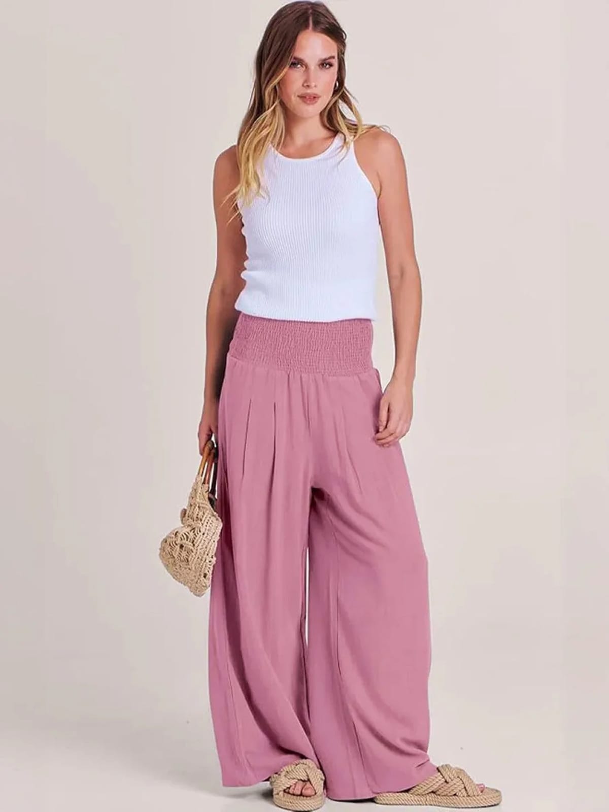 Women's high-waist wide-leg pants with smocked waistband.