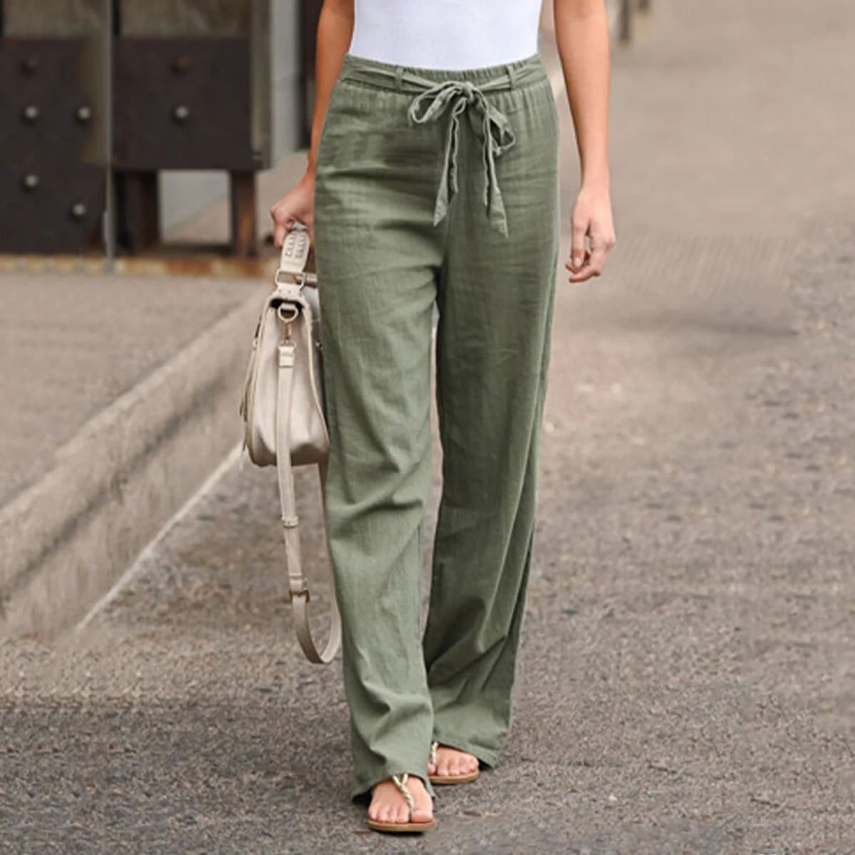 Wide-leg pants with drawstring waist and linen texture.
