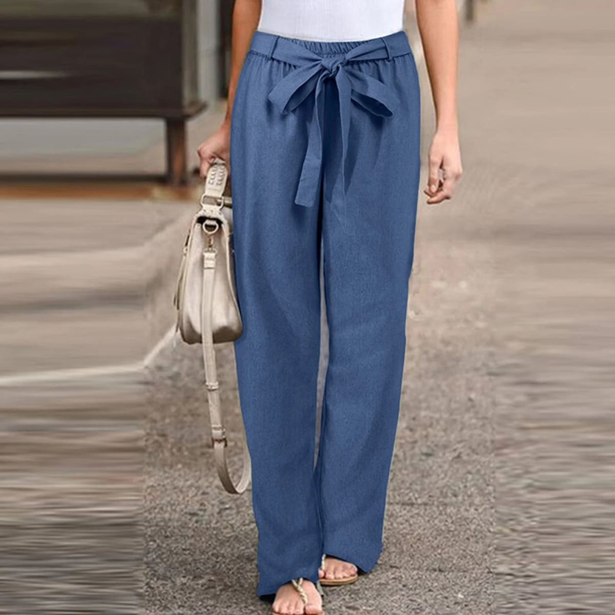 Wide-leg pants with drawstring waist and linen texture.