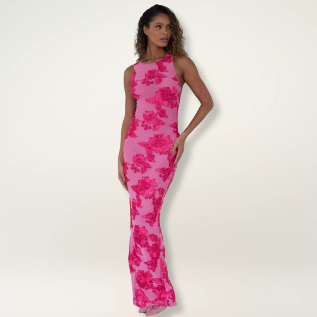 Maxi dress with floral print, flowing silhouette, event-ready.