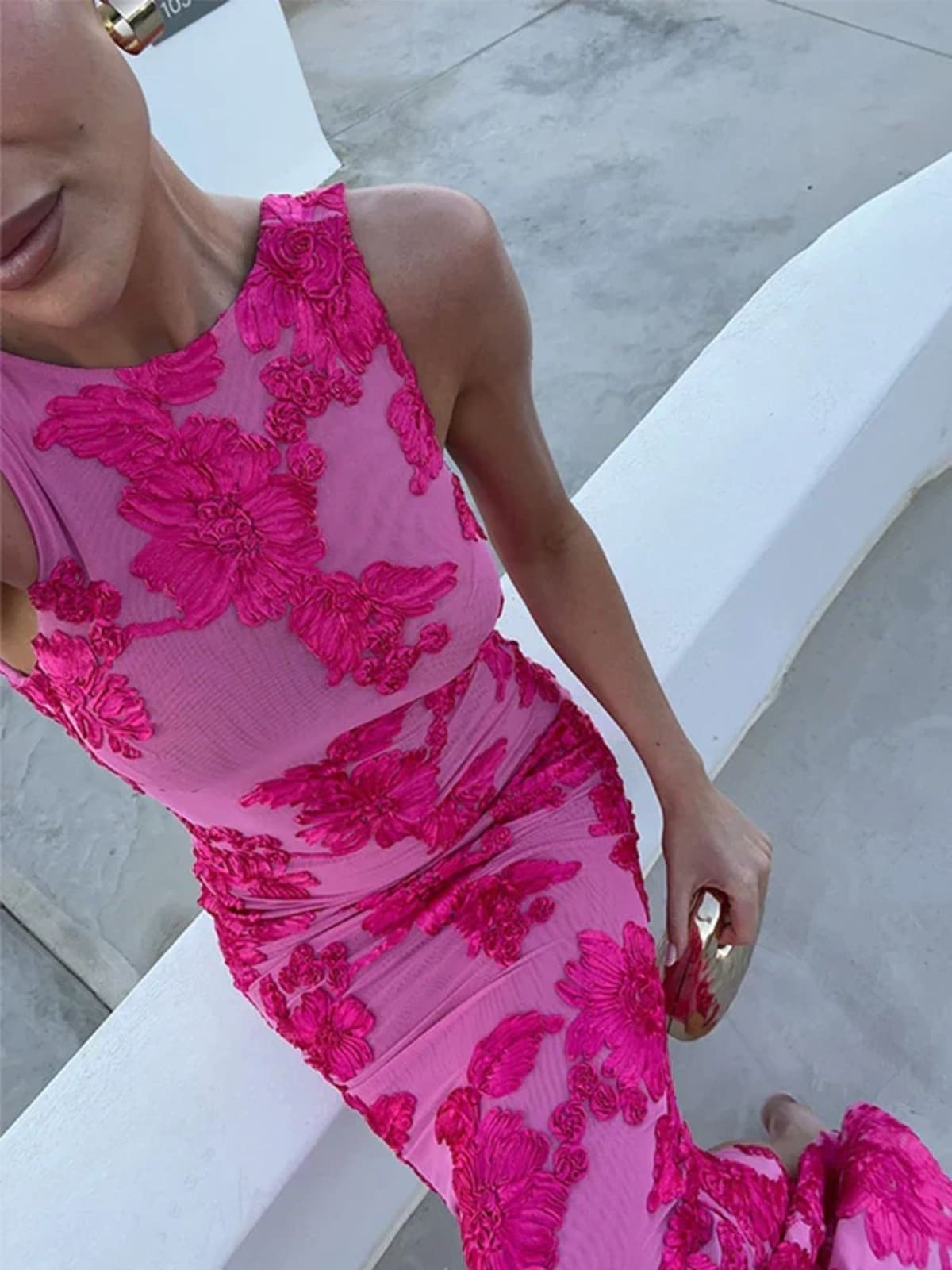 Maxi dress with floral print, flowing silhouette, event-ready.