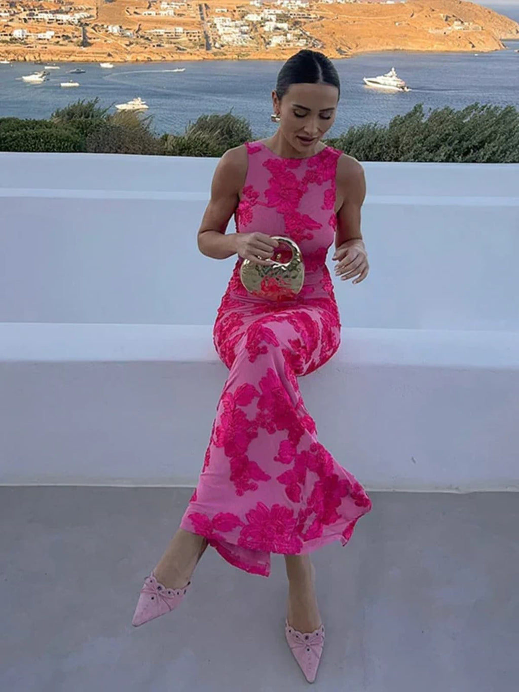 Maxi dress with floral print, flowing silhouette, event-ready.