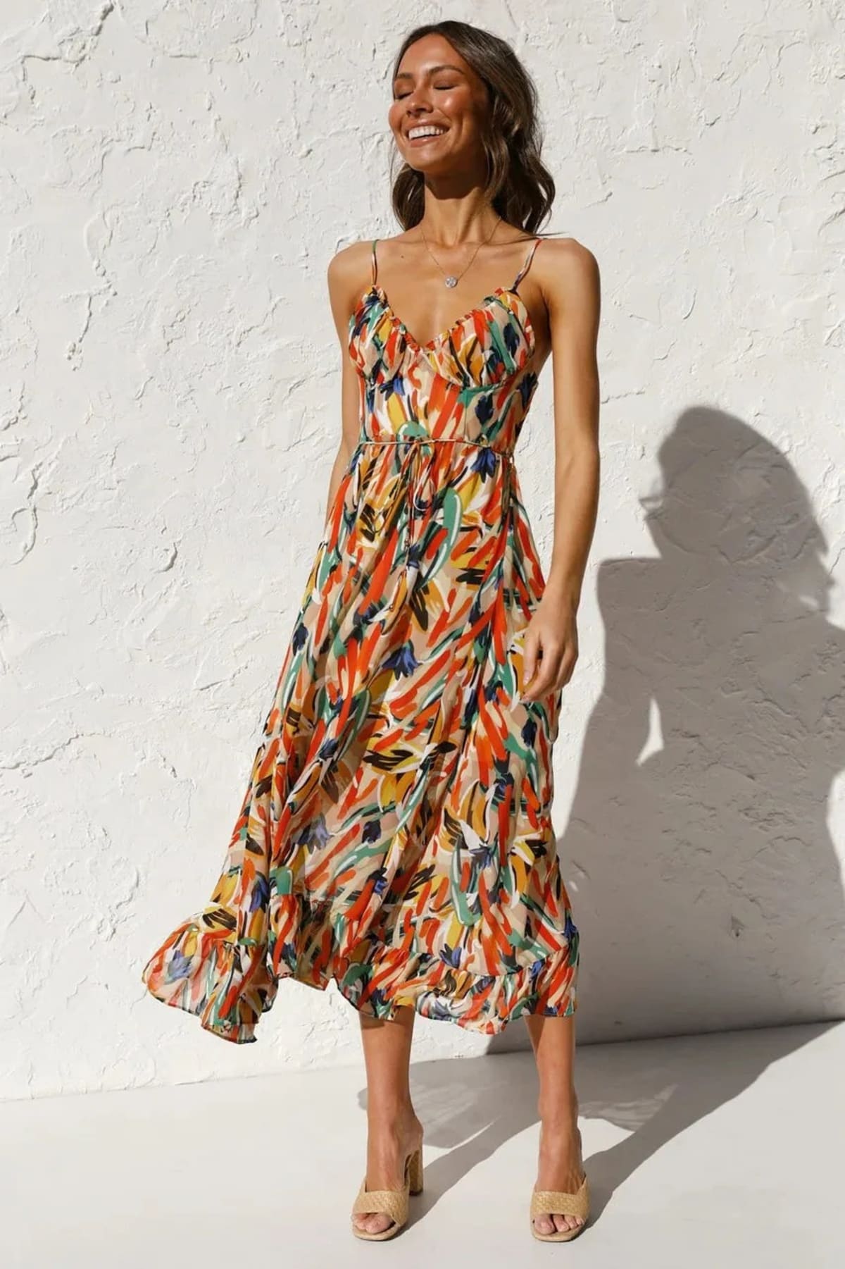 Knee-length dress with unique pattern and fitted silhouette.