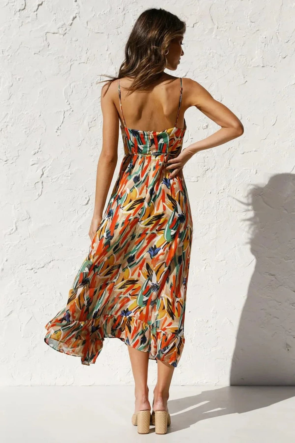Knee-length dress with unique pattern and fitted silhouette.