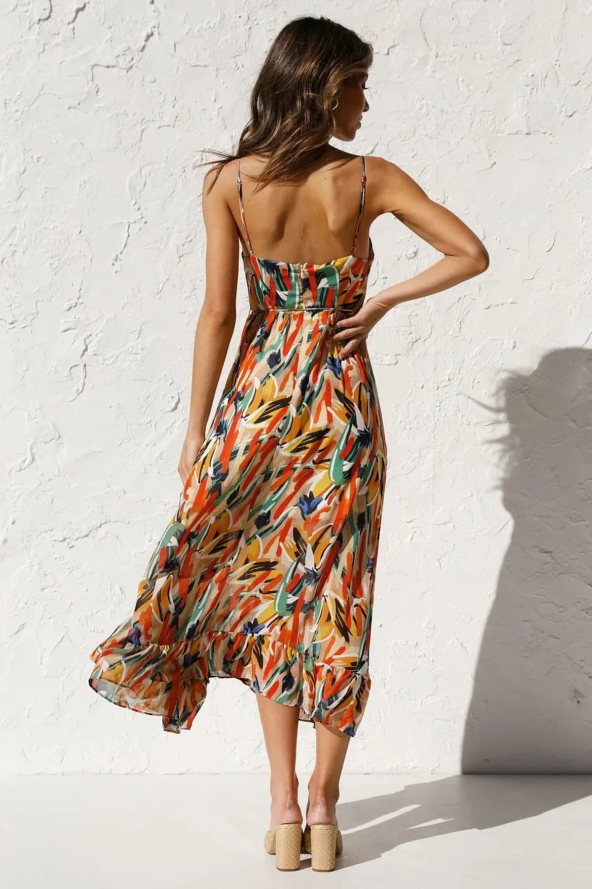 Knee-length dress with unique pattern and fitted silhouette.