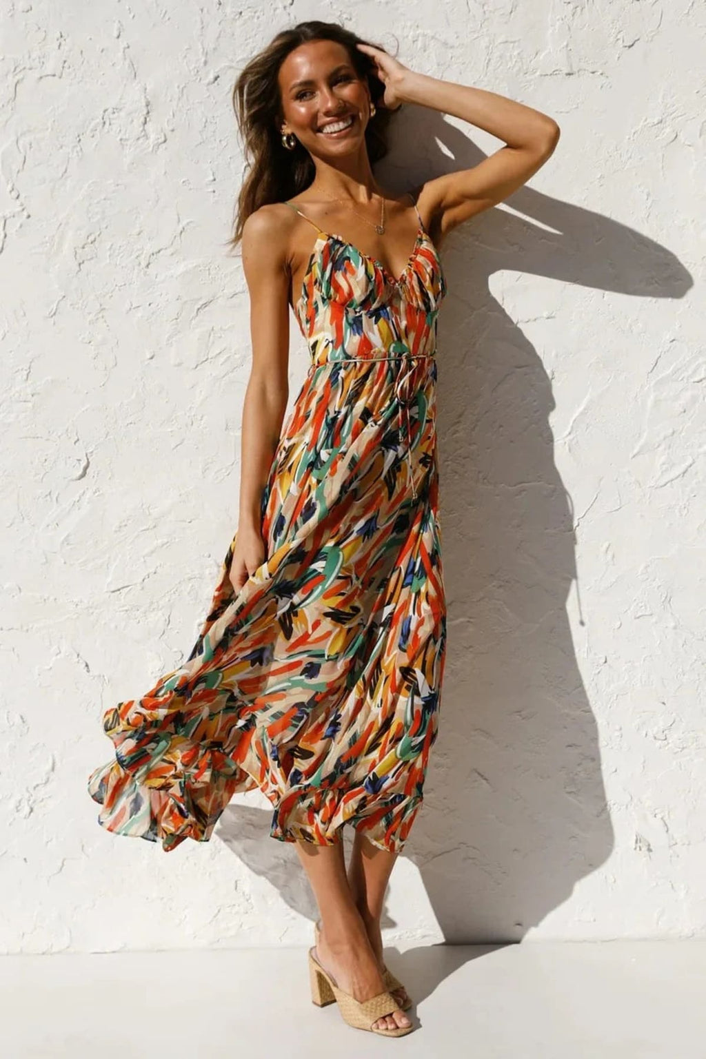Knee-length dress with unique pattern and fitted silhouette.