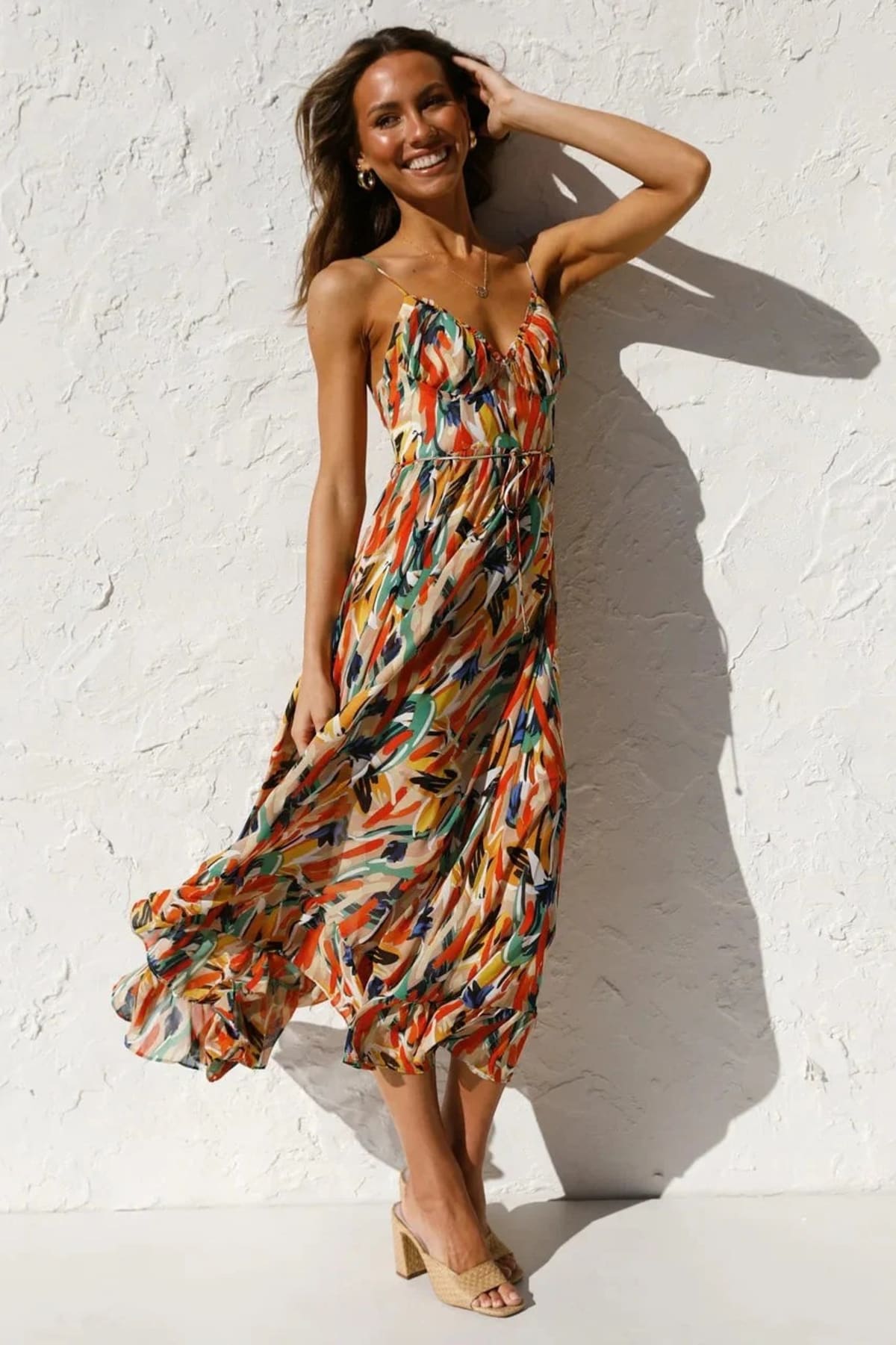 Knee-length dress with unique pattern and fitted silhouette.