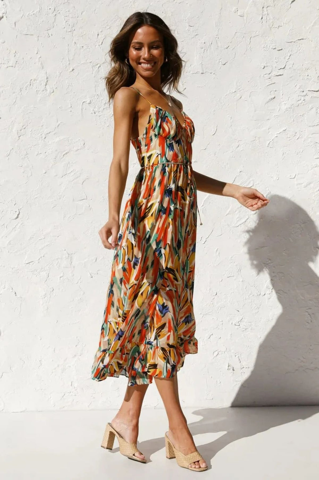 Knee-length dress with unique pattern and fitted silhouette.