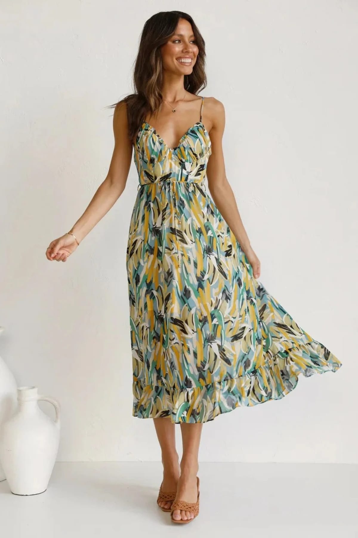 Knee-length dress with unique pattern and fitted silhouette.