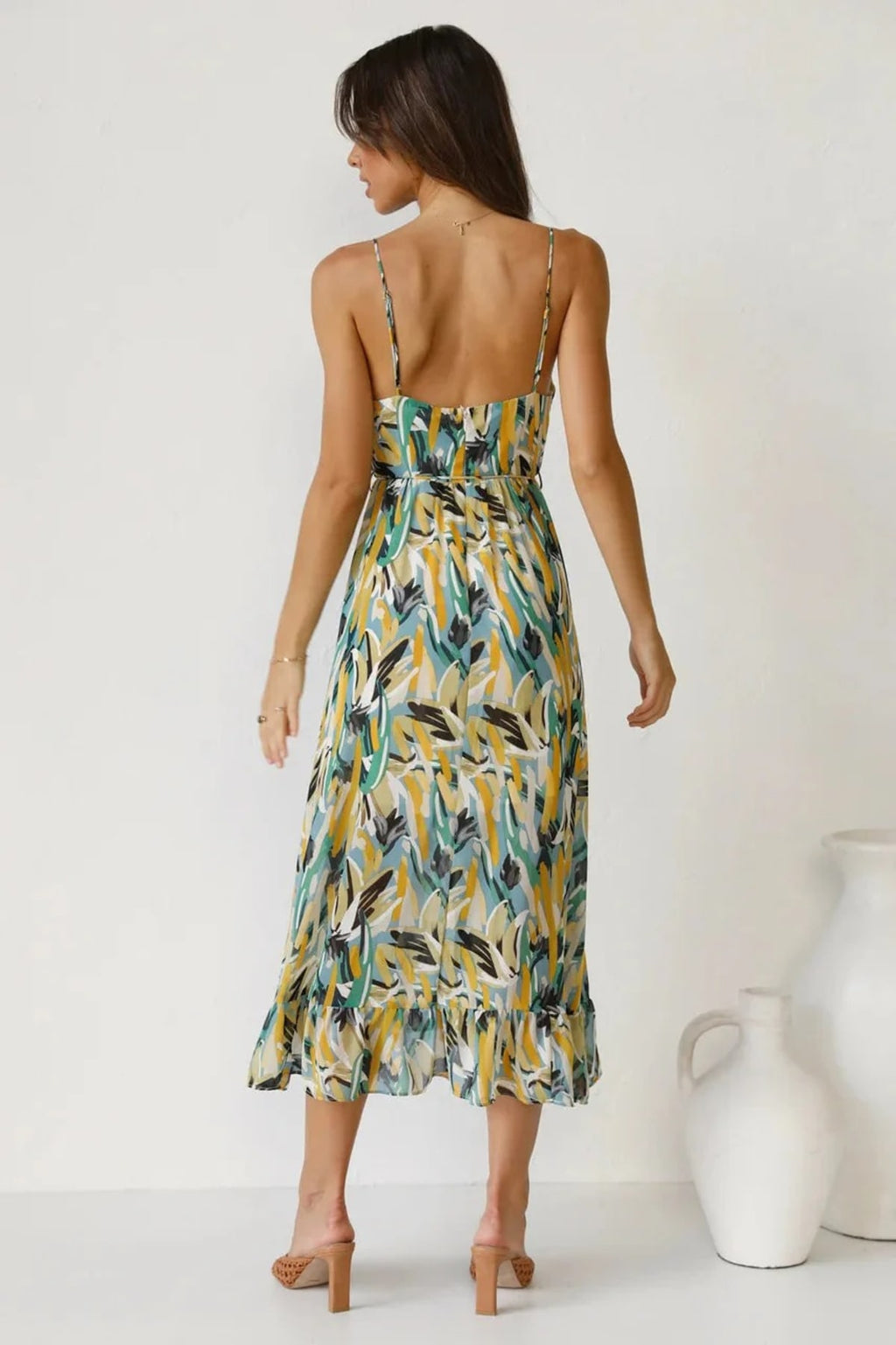 Knee-length dress with unique pattern and fitted silhouette.