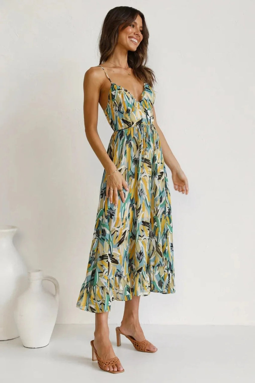 Knee-length dress with unique pattern and fitted silhouette.