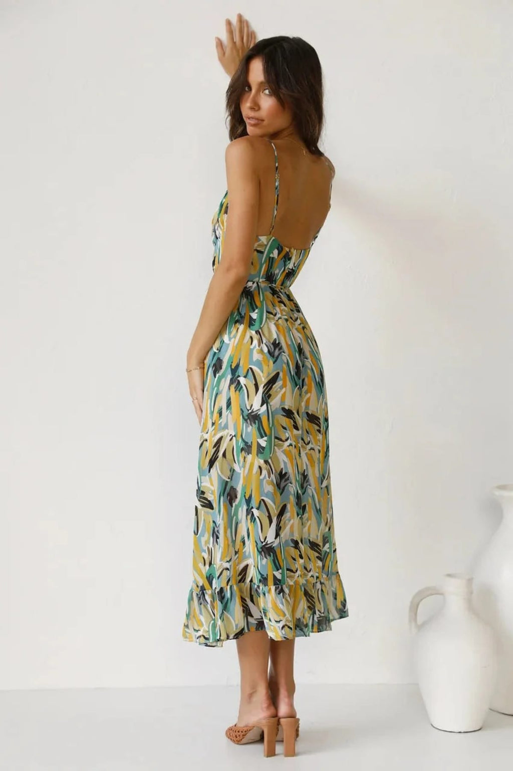 Knee-length dress with unique pattern and fitted silhouette.
