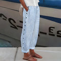 Straight-leg pants with elastic waistband and side pockets for women.