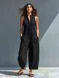 Sleeveless jumpsuit with mandarin collar and wide-leg pants.