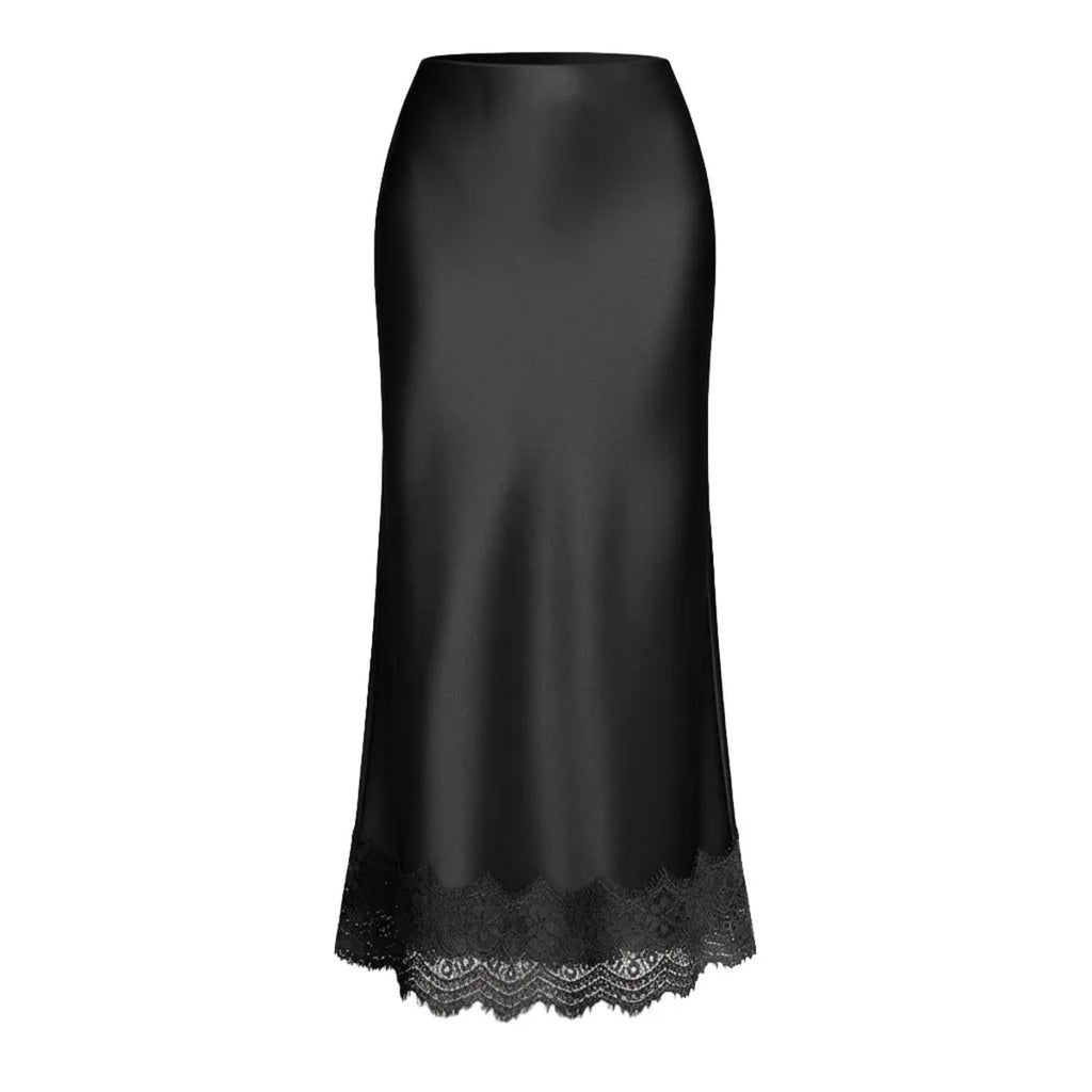 Woman modeling a two-piece crop top and maxi skirt set with lace hem.