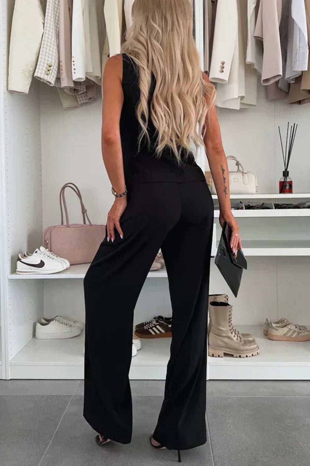 Two-piece button-up co-ord set with matching pants for women.