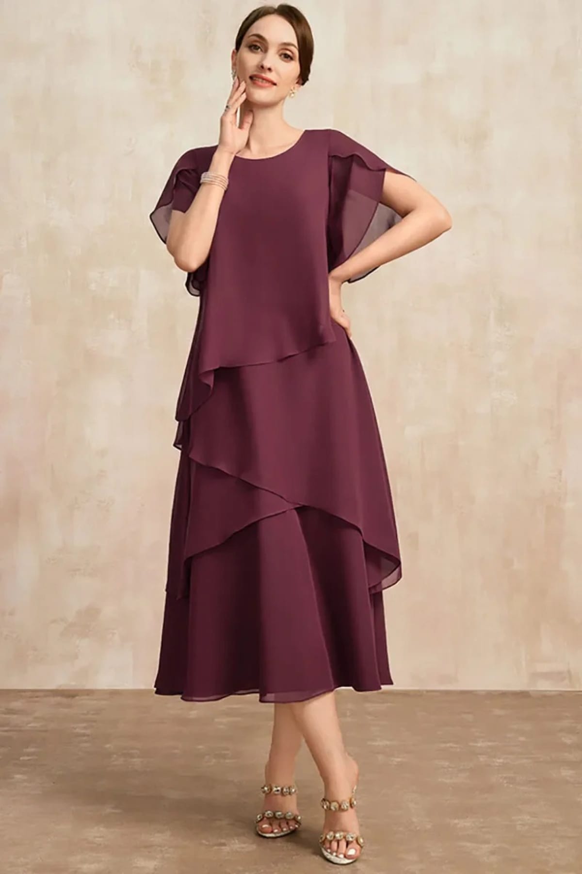 Classic chiffon dress with flowing silhouette, perfect for warm days.