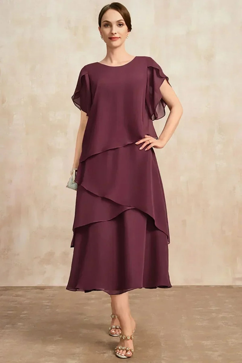 Classic chiffon dress with flowing silhouette, perfect for warm days.