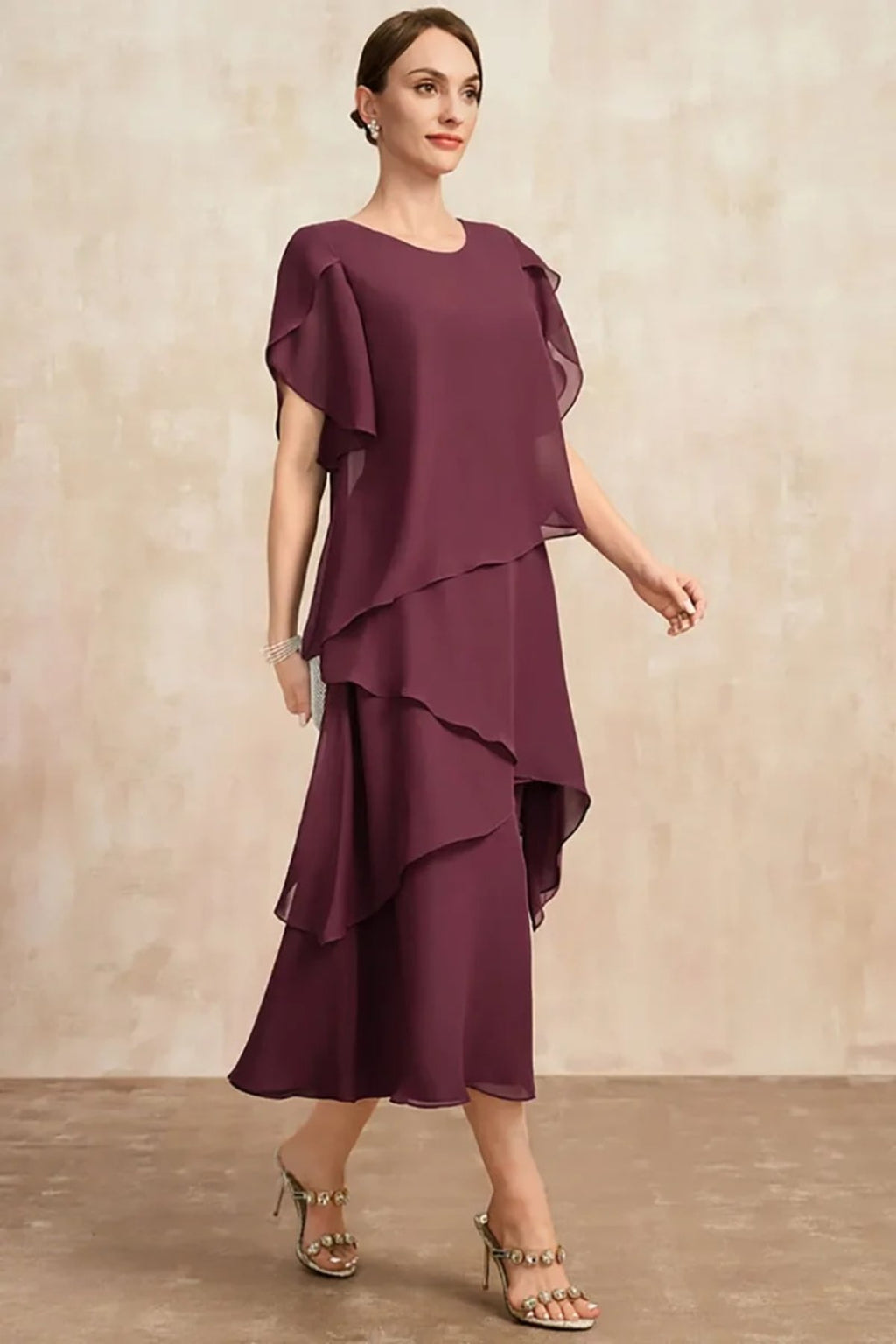 Classic chiffon dress with flowing silhouette, perfect for warm days.